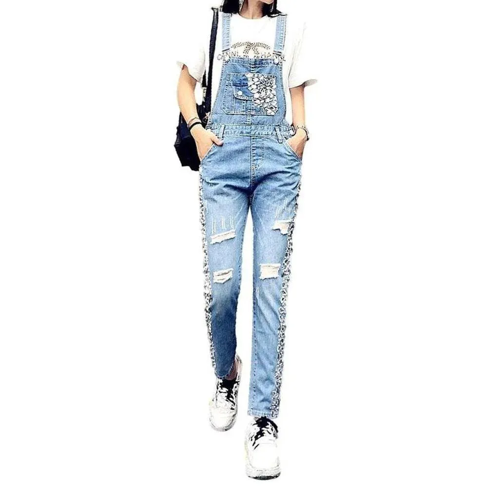 Ripped women's denim dungaree